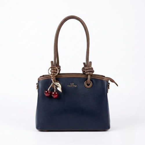 شنطة يد نسائية أنيقة بتعليقة كرز وألوان عصرية