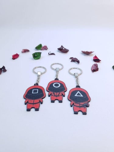 ميدالية مفاتيح شخصية الحبار برأس كبير