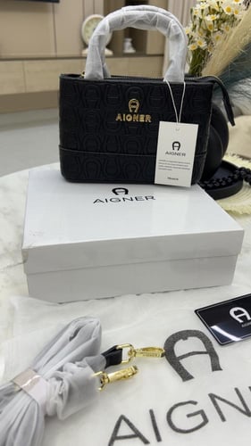 شنطة اقنر _ أسود لمعه