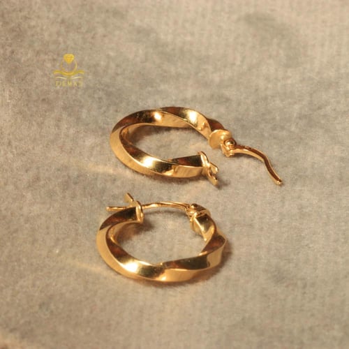 حلق دائري تويستد ذهب صافي عيار 18