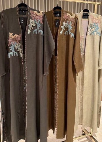 Natural linen abayas with hand-drawn design