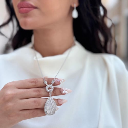 طقم (سلسال بوشرن طويل + حلق) مطليين