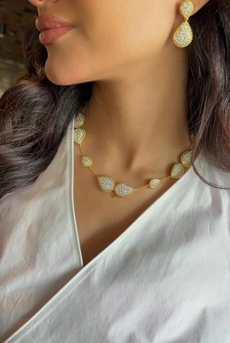 طقم فاخر (سلسال مرصع بالزريكون + حلق) مطلي بالذهب