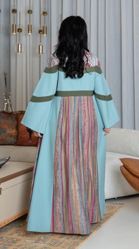 جلابية بلون سماوي ببروش على الصدر