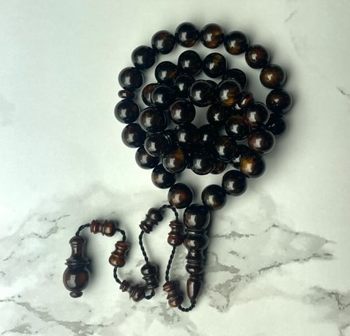 A brown Fatturan prayer bead string