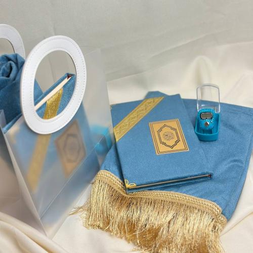 A gift of a prayer rug and a Quran