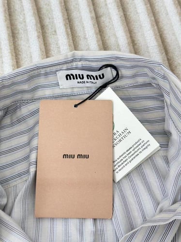 قميص miu miu