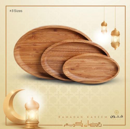 A set of 3 natural wood oval serving trays