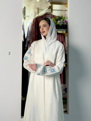 Fabric: Luxurious Copro Linen (cool, flowing, and with a sophisticated matte shine). Design: White abaya with a soft classic cut....