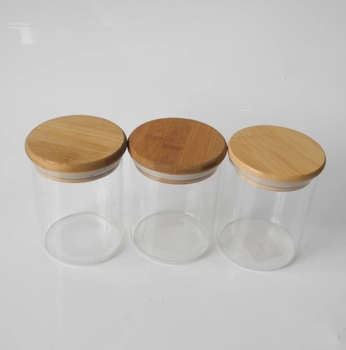 مجموعة علب بهارات زجاج بغطاء خشب مع استند خشبي