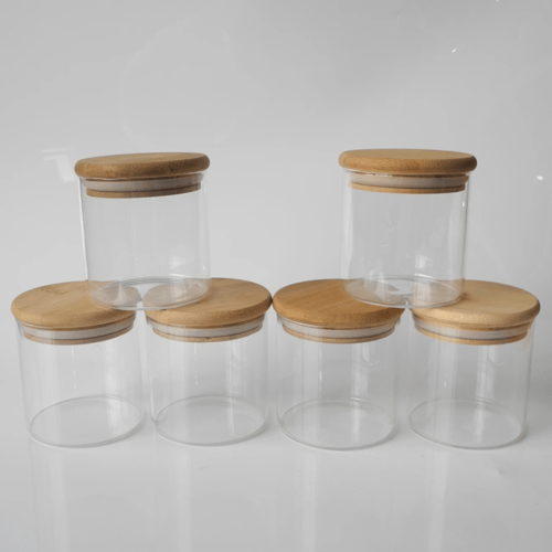 مجموعة علب بهارات زجاج بغطاء خشب مع استند خشبي