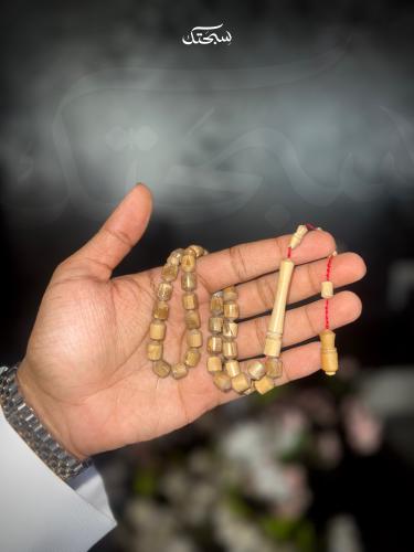 سبحه اليسر الأبيض برميلي