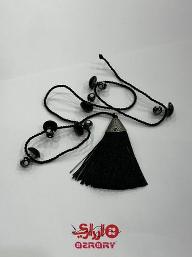 تركيبات عظم من ازراري باللون الاسود