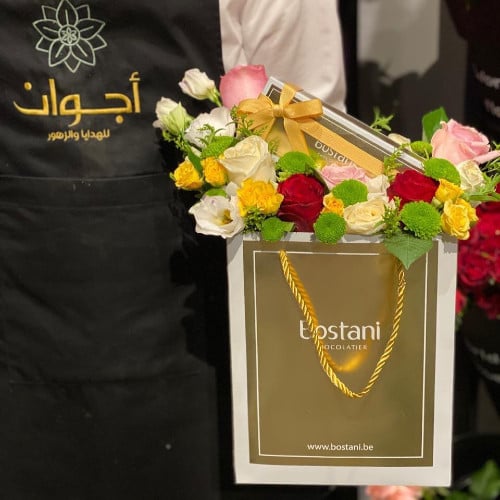 Bouquet of roses and chocolate, gardener