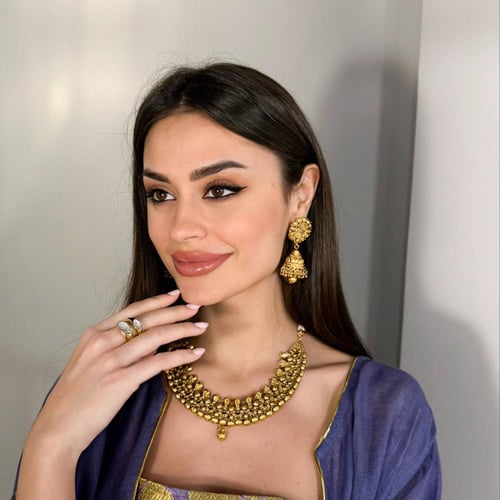 طقم مطلي هندي عبار عن عقد واقراط اذن