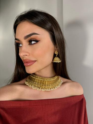 طقم مطلي هندي عبار عن عقد واقراط اذن