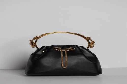 حقيبة سهرة فاخرة من الجلد الصناعي ومقبض من المعدن...