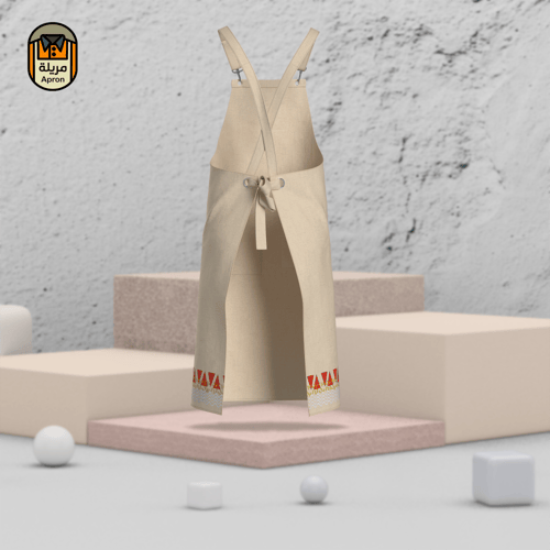 مريلة بلون بيج مع جلد أحمر واضافة تطريز