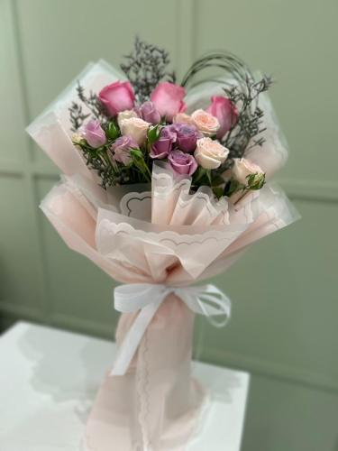 A bouquet of rose flowers with pink wrapping (number 070)