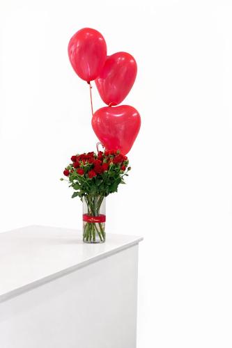 A bouquet of flowers with a balloon 041