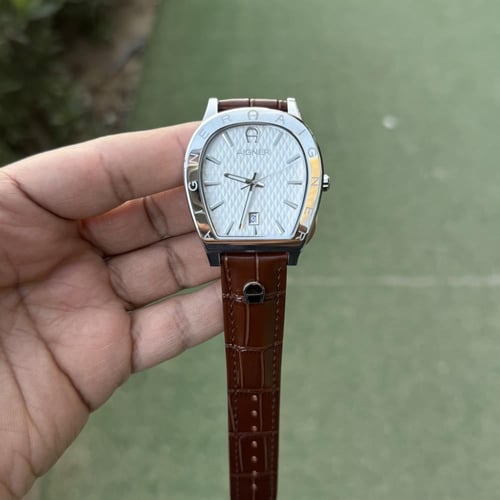 ساعة اقنر رجالي بني في فضي