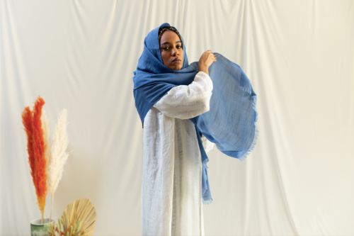 Dark sky blue linen headscarf spread from the edge...