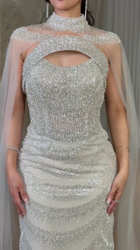 فستان سهرة شك بلون عاجي لؤلؤي