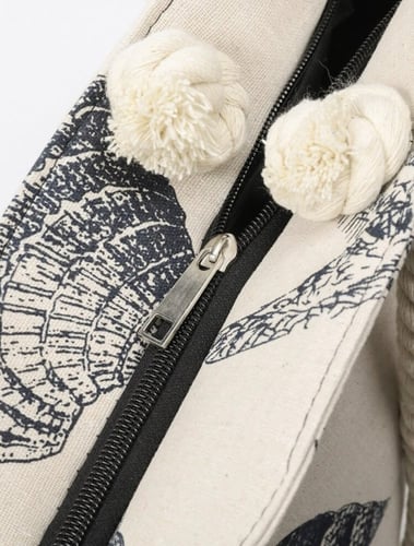 حقيبة اسود وابيض برسمات الصدف