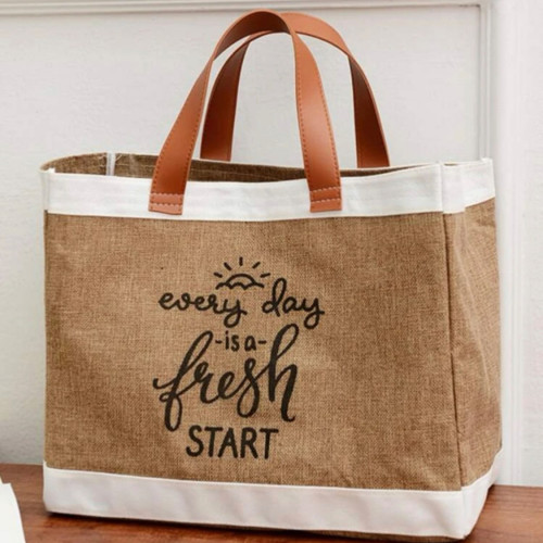 حقيبة بملمس الخيش ومسكة جلد