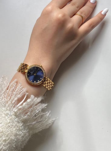 ساعة نسائية ذهبي بميناء ازرق غامق