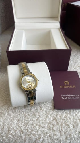 ساعة اقنر نسائيه ذهبي مع فضي شامل ملحقاته