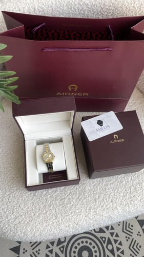 ساعة اقنر نسائيه ذهبي مع فضي شامل ملحقاته