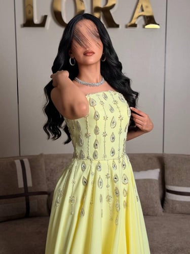 فستان سهرة ليموني فاخر بتطريز أنيق وقصة منفوشة ناع...