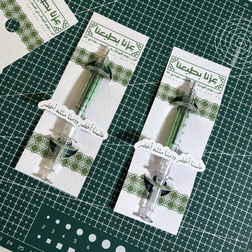 ( قلم الابره + كرت ) توزيعات اليوم الوطني