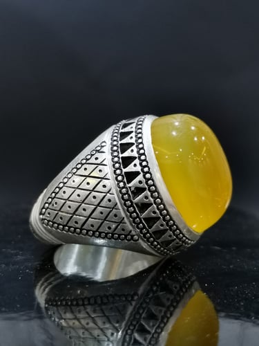 خاتم الفضة بحجر خرساني ايراني أصفر بصياغة الخفاش ا...