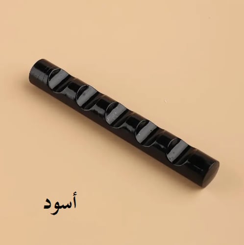 مسند بلاستيكي صغير لأقلام الخط والريش