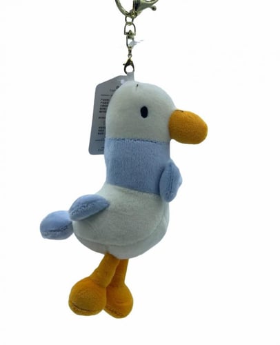 ميدالية ( تعليقة ) من الفرو على شكل طائر