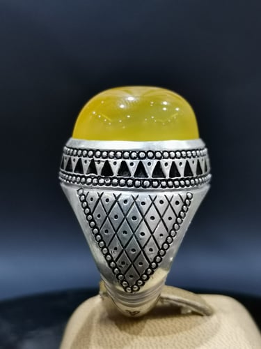 خاتم الفضة بحجر خرساني ايراني أصفر بصياغة الخفاش ا...