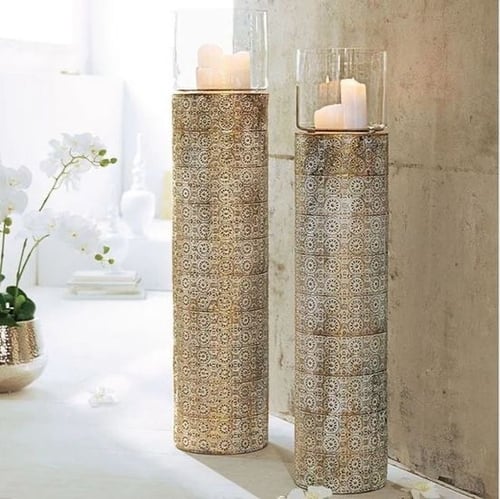 طقم من الشمعدان المعدني المنقوش وذو دورين ،،