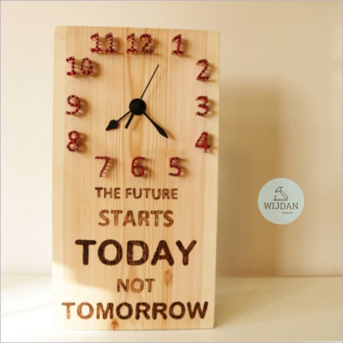 ساعة حائط خشبيه { المستقبل يبدأ اليوم وليس غداً} م...