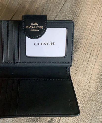 محفظة coach