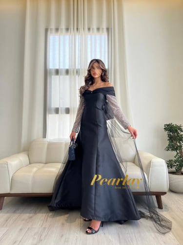 فستان سهره اسود باكمام شفافه فضي