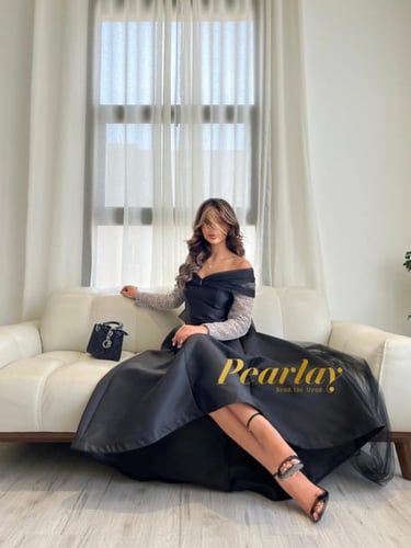 فستان سهره اسود باكمام شفافه فضي