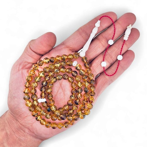 سبحة كهرمان بلطيقي طبيعي 99 خرزة بفواصل عظم الجمل...