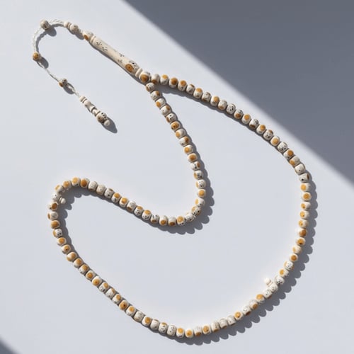 سبحة فاخرة من عاج ناب الفيل مطعم فضة و كهرمان طبيع...