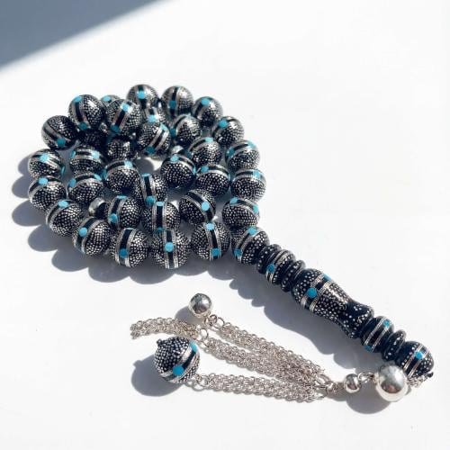 سبحة كوك و الشاهد يسر طبيعي مطعمة بالفضه ولون الفي...