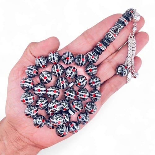 سبحة كوك و الشاهد يسر طبيعي مطعمة بالفضه ولون المر...