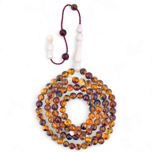 سبحة كهرمان بلطيقي طبيعي 99 خرزة بفواصل عظم الجمل...