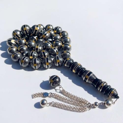 سبحة كوك و الشاهد يسر طبيعي مطعمة بالفضه ولون الكه...