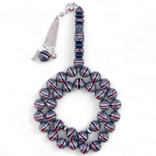 سبحة كوك و الشاهد يسر طبيعي مطعمة بالفضه ولون المر...